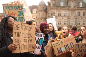 women holding signs at protest march